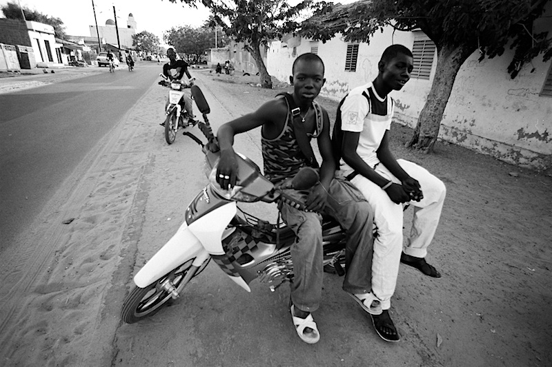 'Eladj "The Butcher" & Friend', Taxi stand in the neighbourhood of Kasavil.